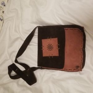 Leather hand made cross body bag.